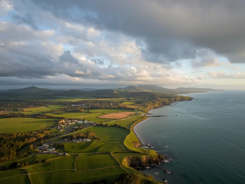Aerial view of Northern Ireland's varied landscape with farmland, hills, and coastal areas